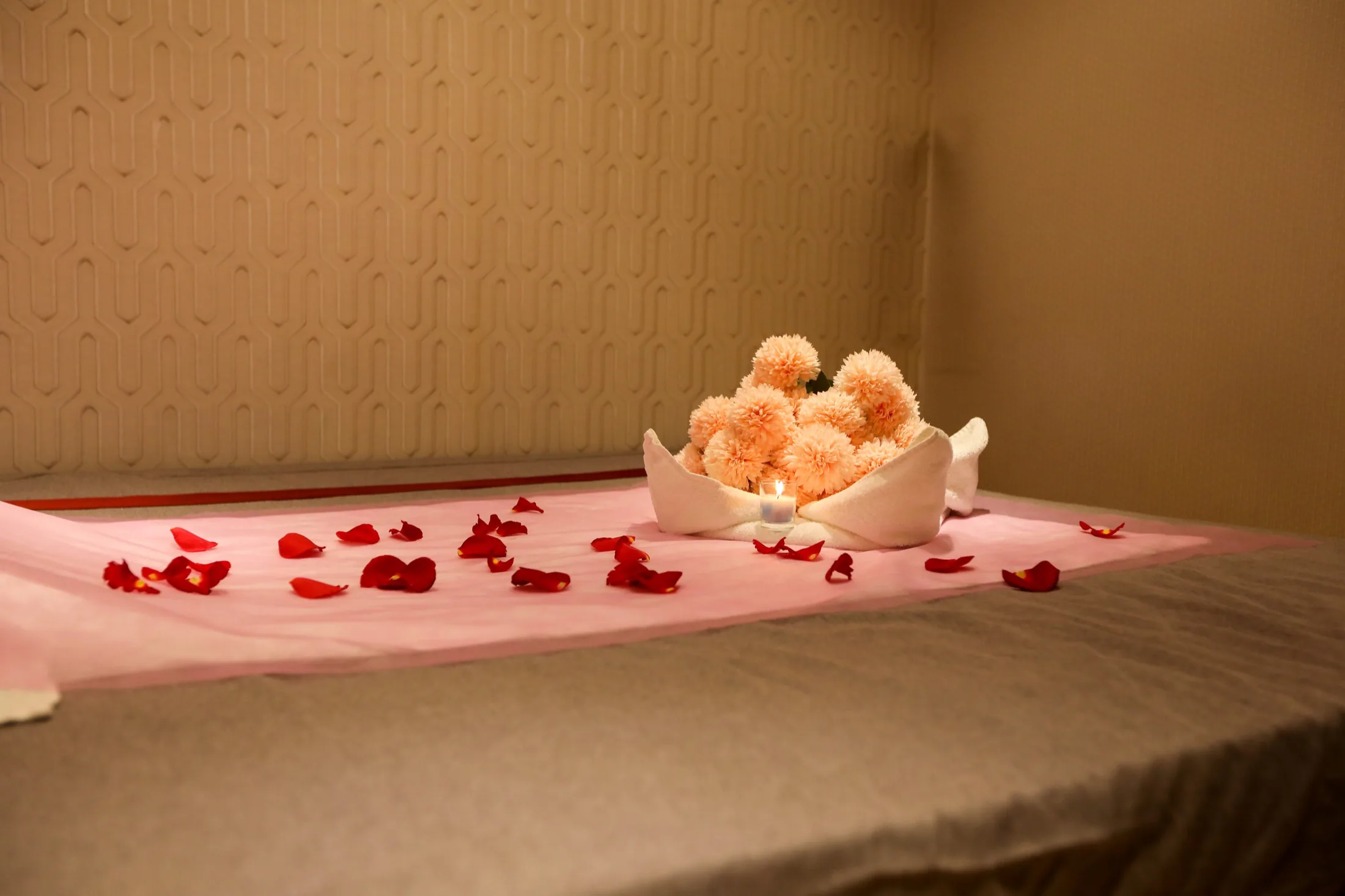 Floral bed arrangement in luxury suite at Impressive Spa Dubai Marina